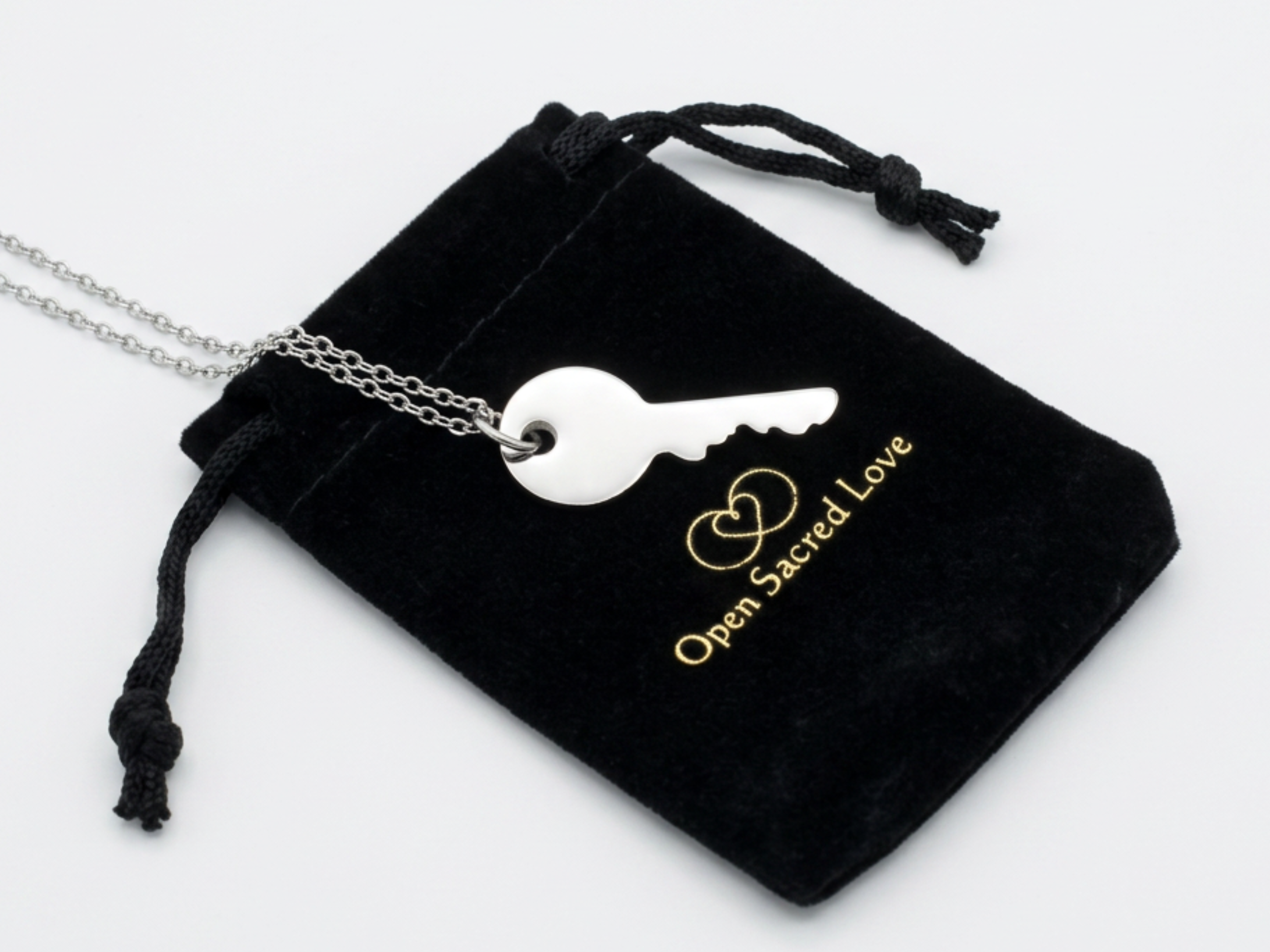 Silver Key necklace worn by a member
